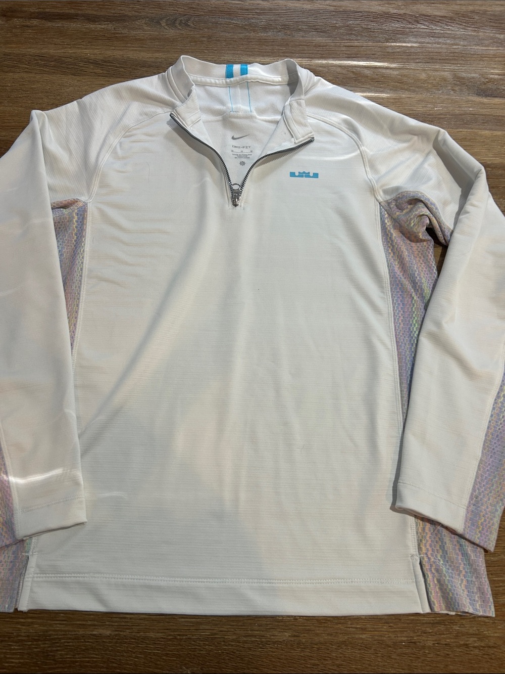 That's a white Nike LeBron James Warm DNA Half-Zip top medium